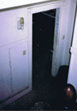 A blurry photo of an open door in the dark.